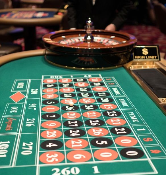 A sleek live dealer roulette table with high‑limit signage
